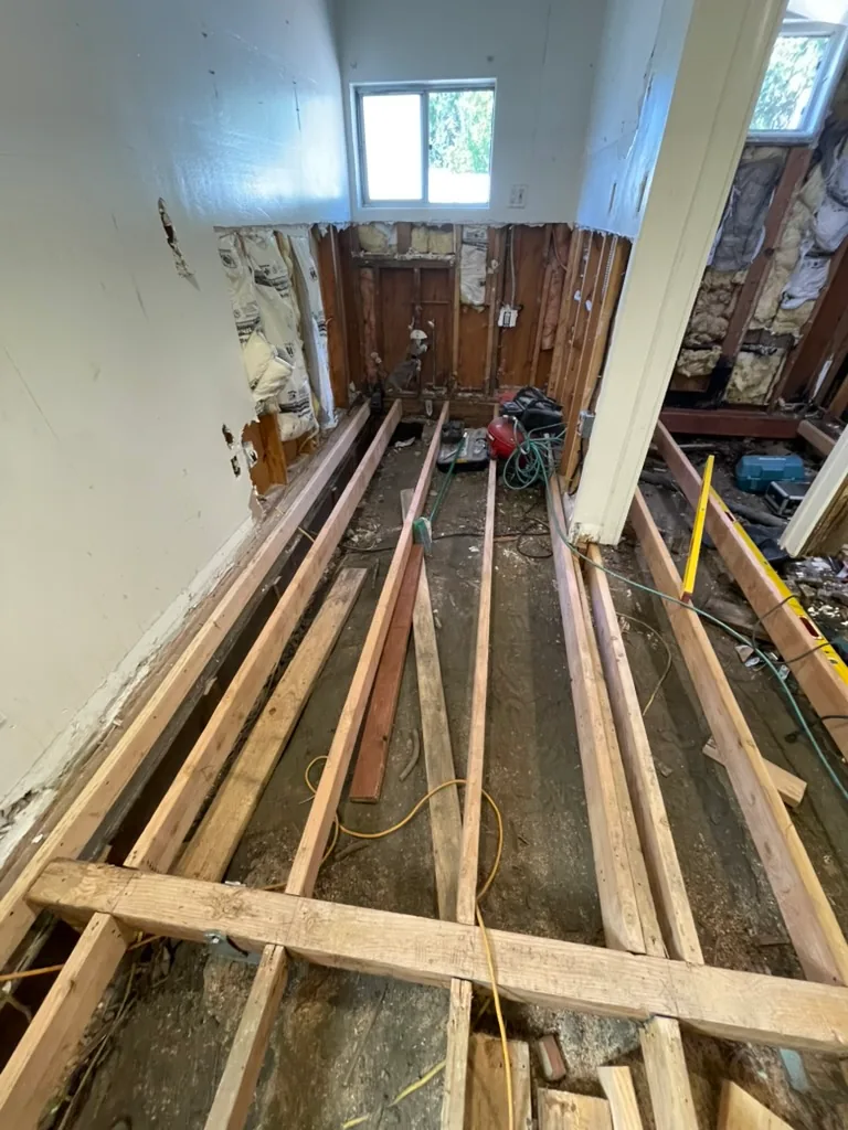 New floor joists laid across the main room
