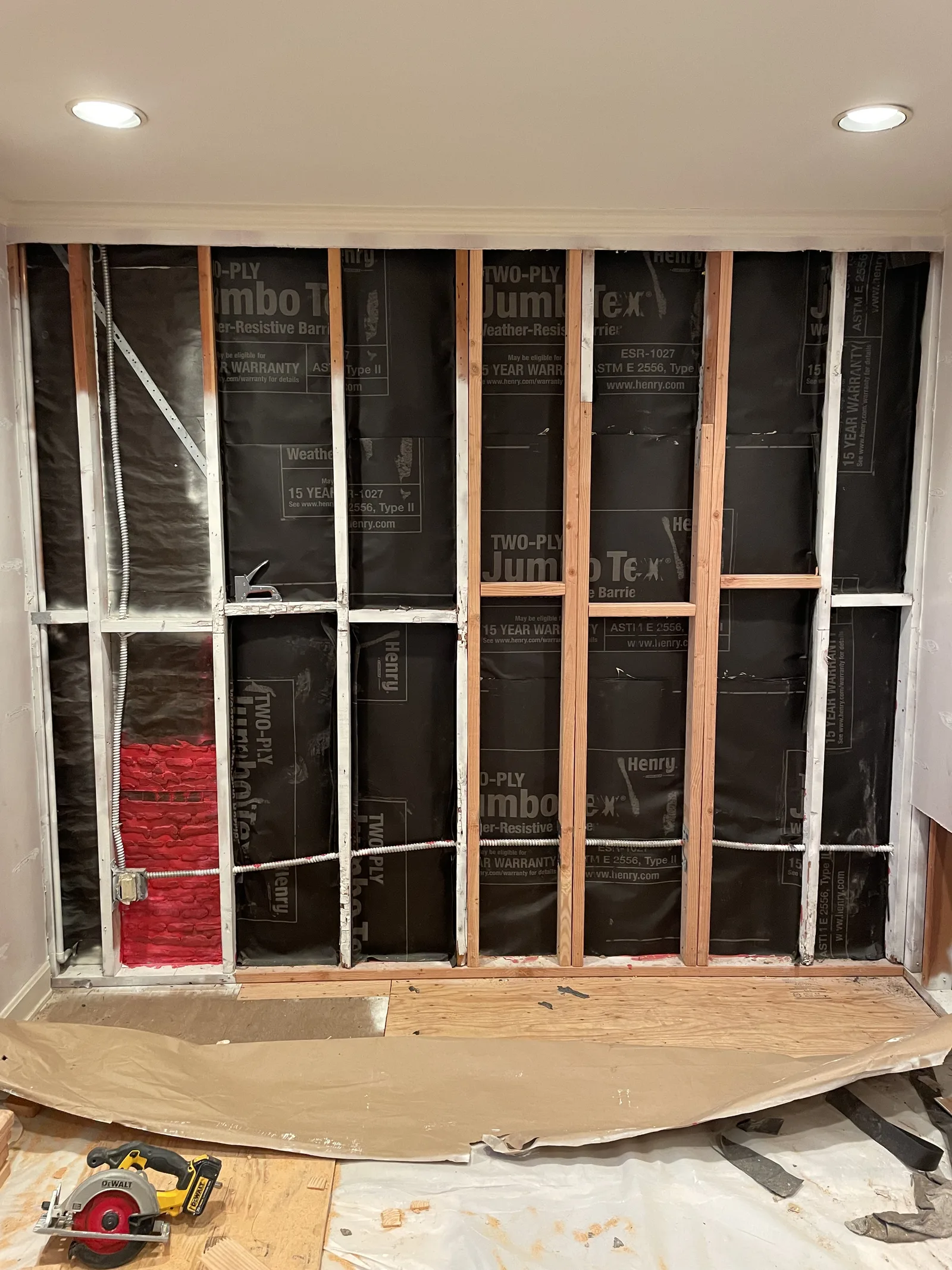 A new interior wall framed and wrapped, with insulation in one stud bay