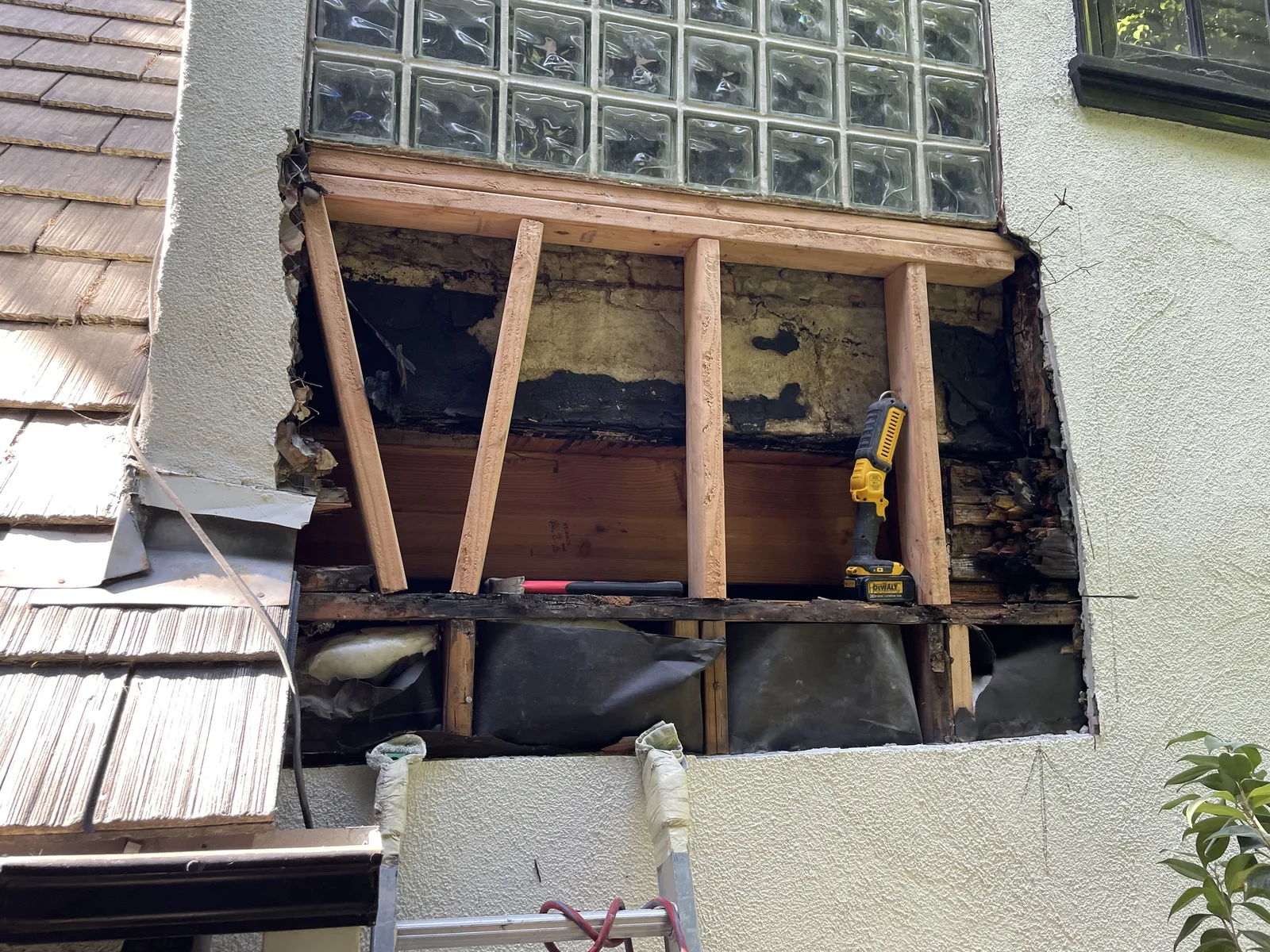 New wood blocking installed below a window to replace a rotted sill