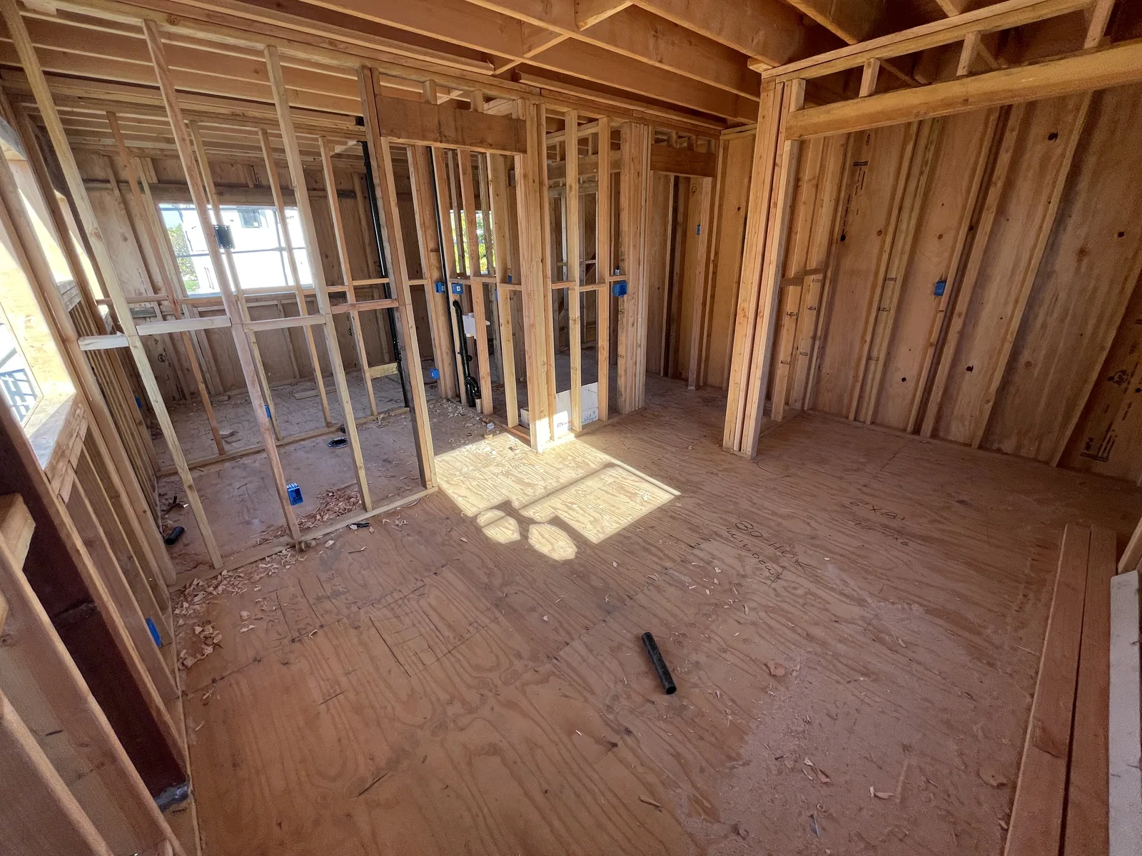 Interior wall framing on a second floor, including closet layouts and window openings