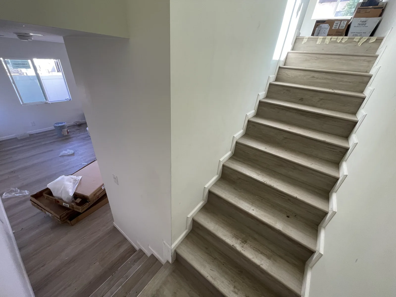 A closer view of finished stair treads and white trim