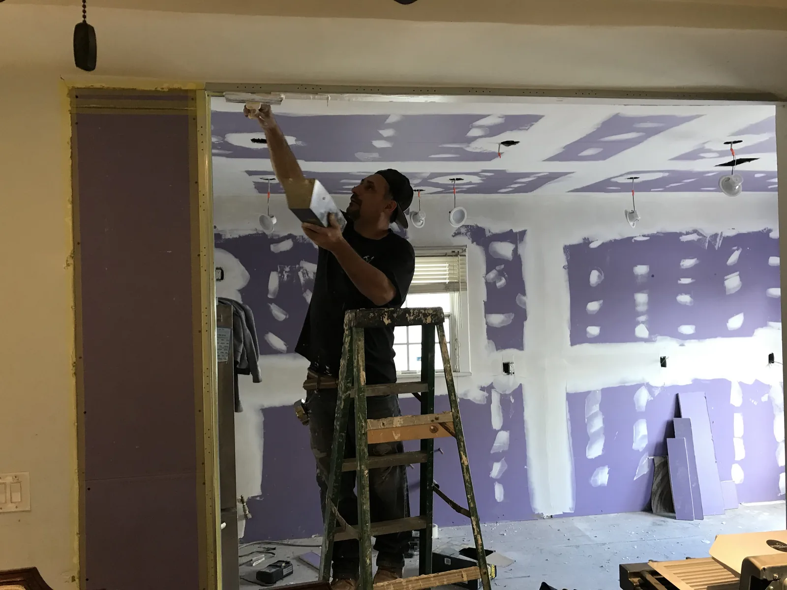 A new header beam spanning a wide opening where a load-bearing wall used to be