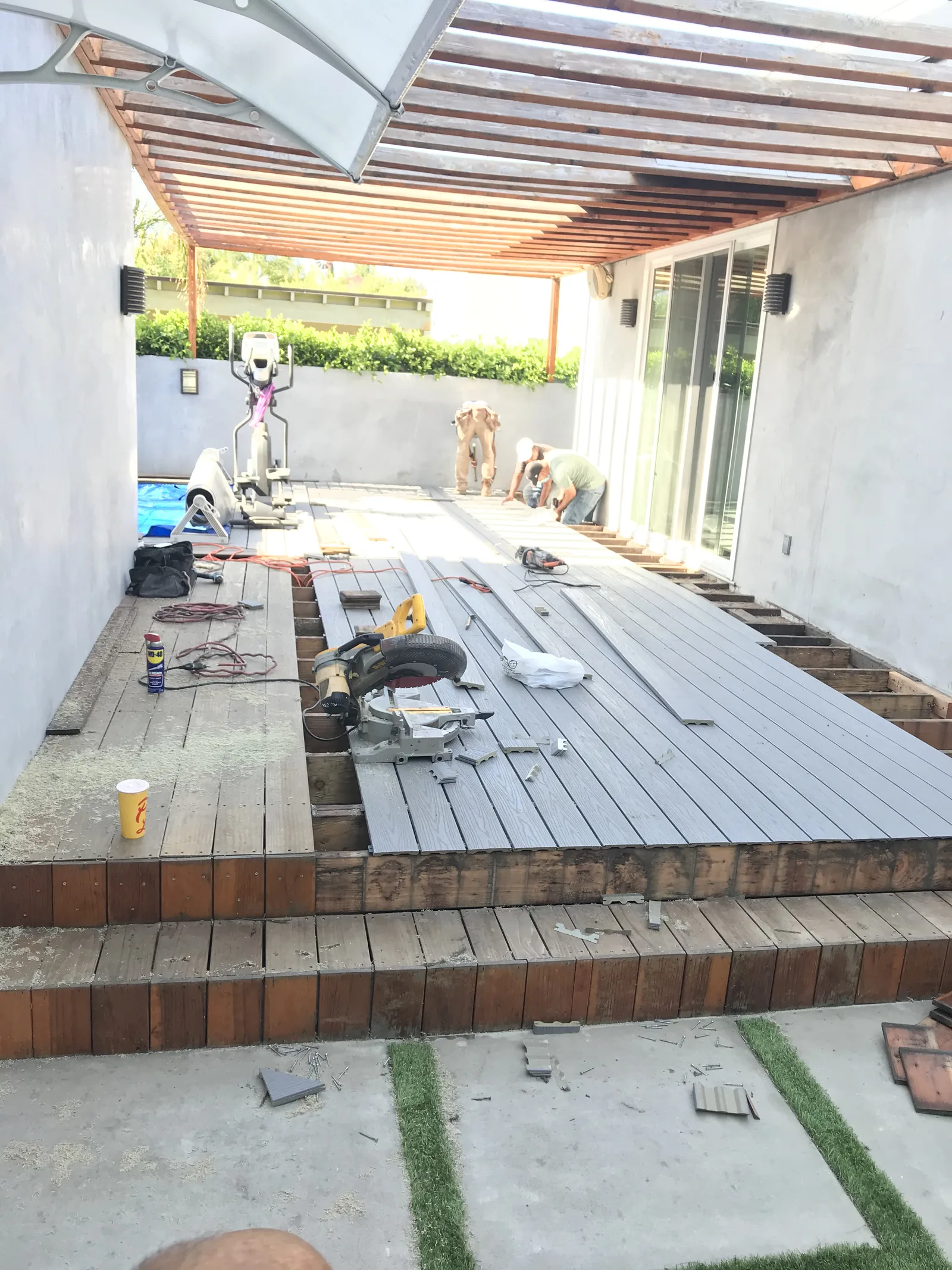New Trex decking partly installed over the old deck framing