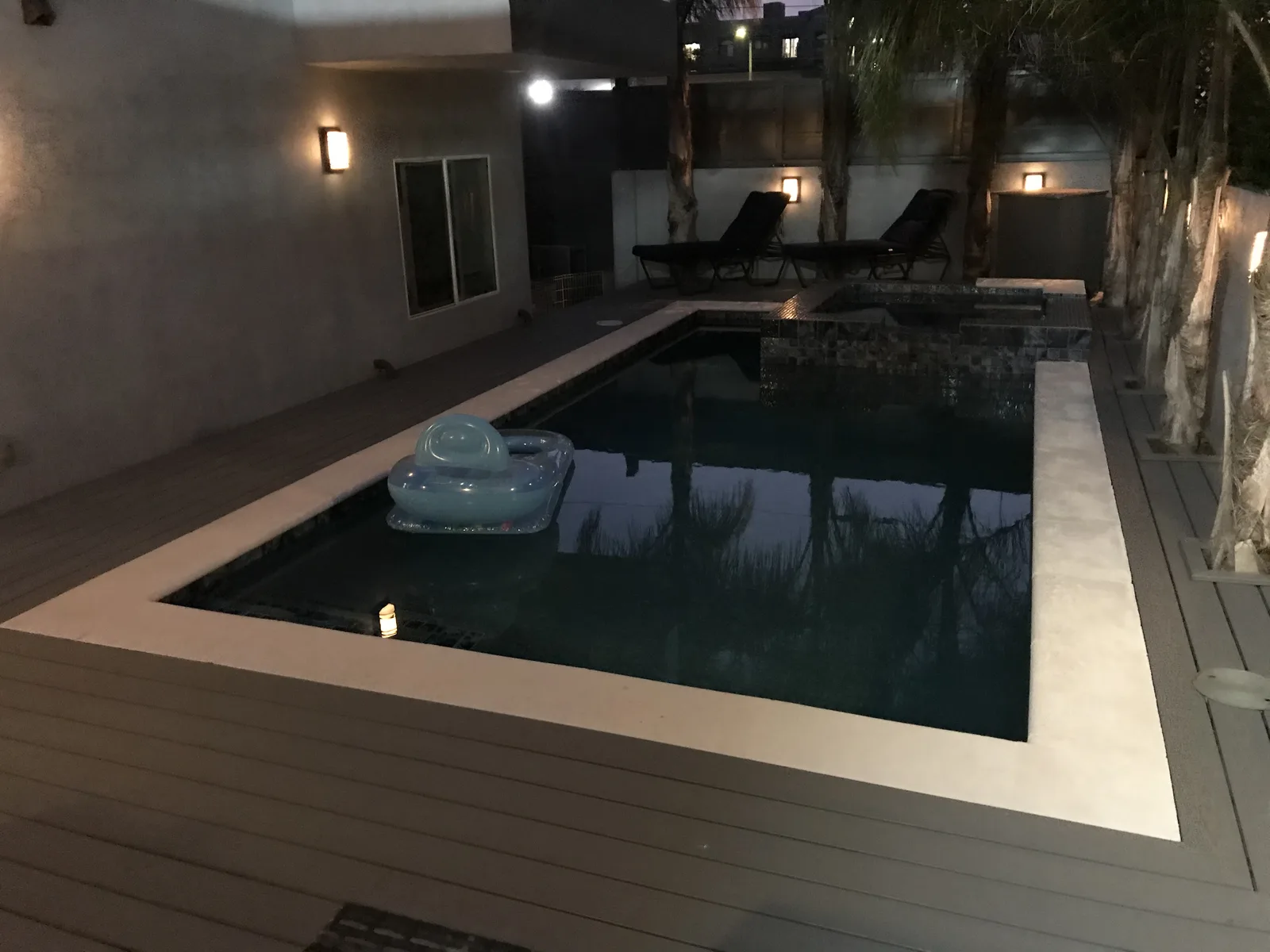The finished pool and Trex decking at night