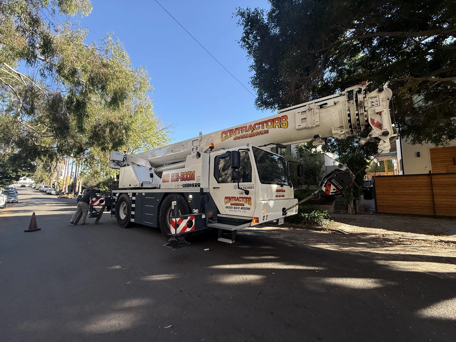 A mobile crane positioned on the street again, weeks after the first visit