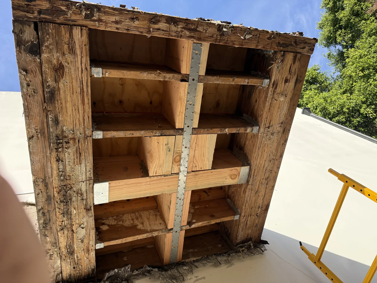 Another angle of the new wood framing rebuilding the balcony structure