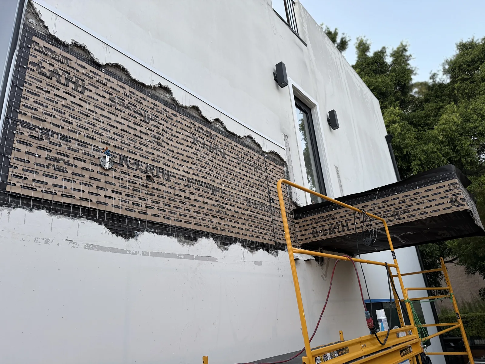 A wire lath patch installed over the repaired section of exterior wall
