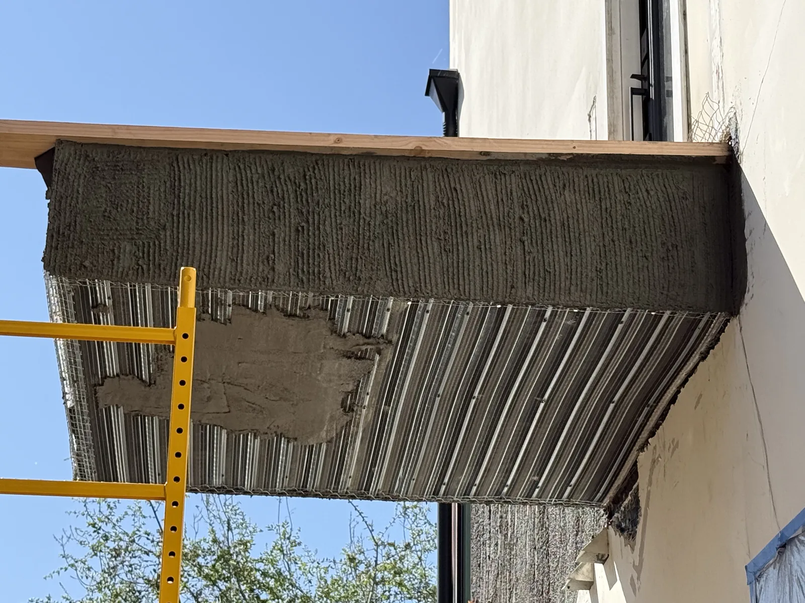 A close view of the waterproof membrane applied to the exterior wall