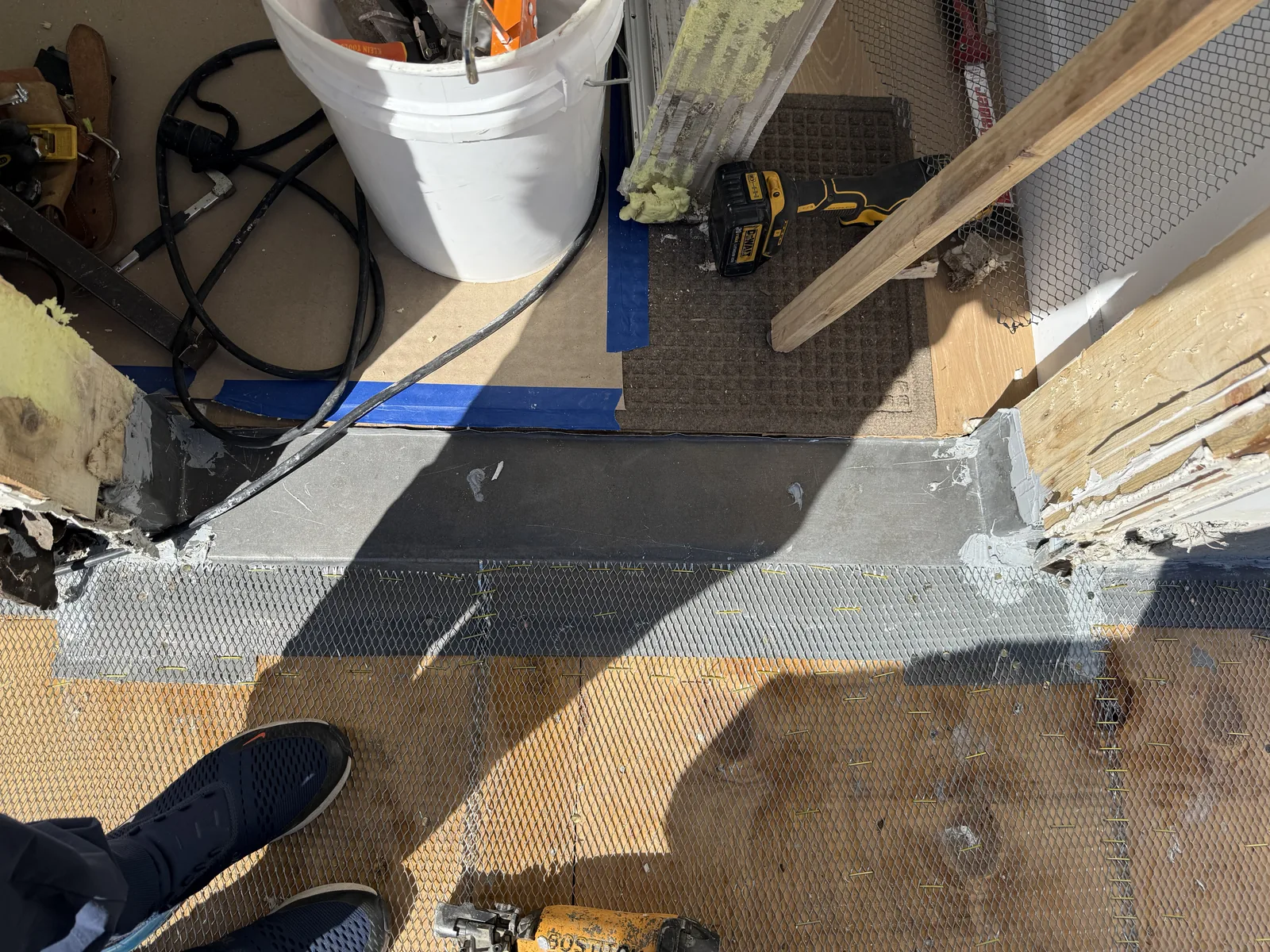 A close view of the waterproof coating detail at the deck edge