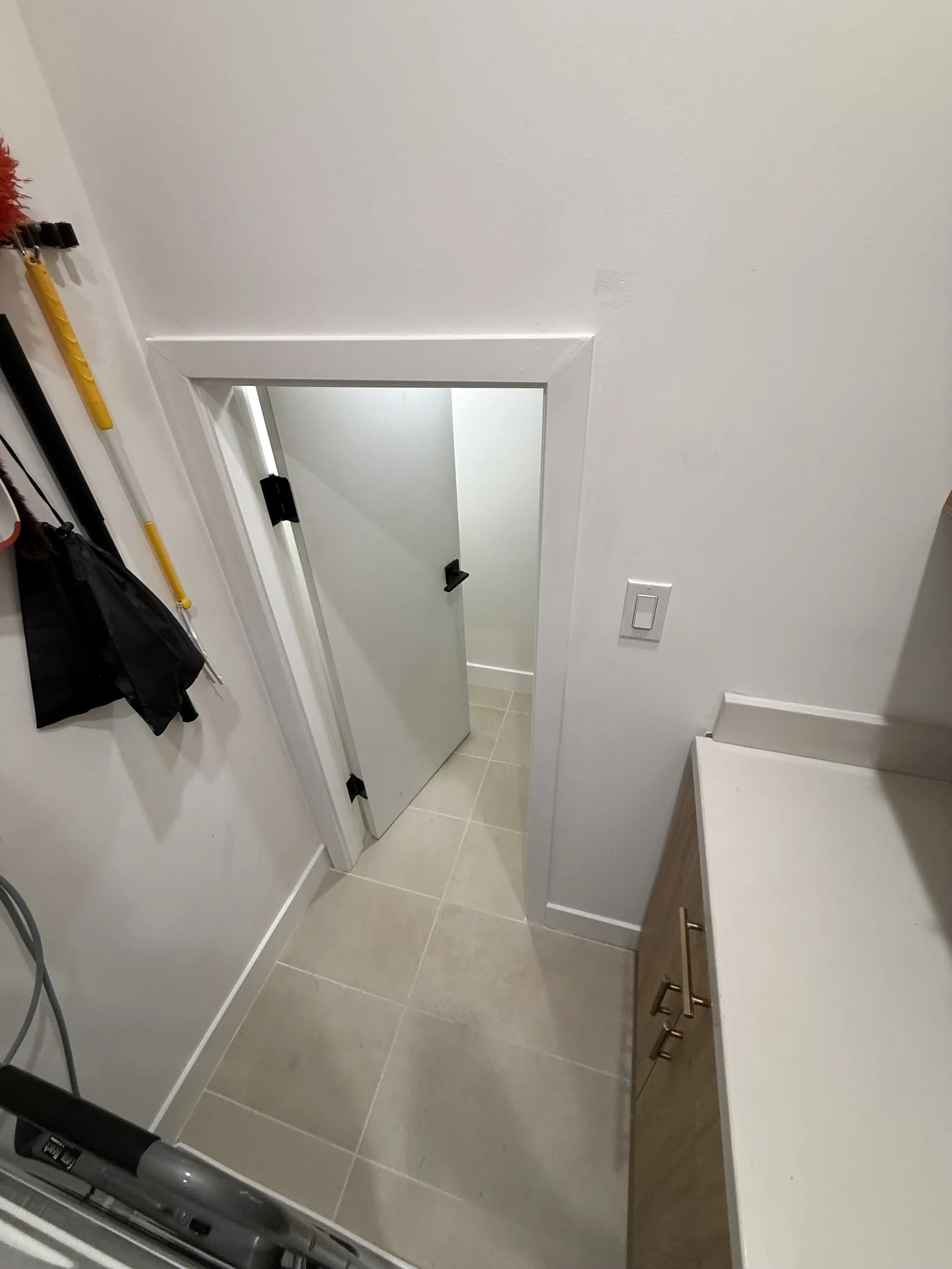 A finished interior hallway with tile flooring