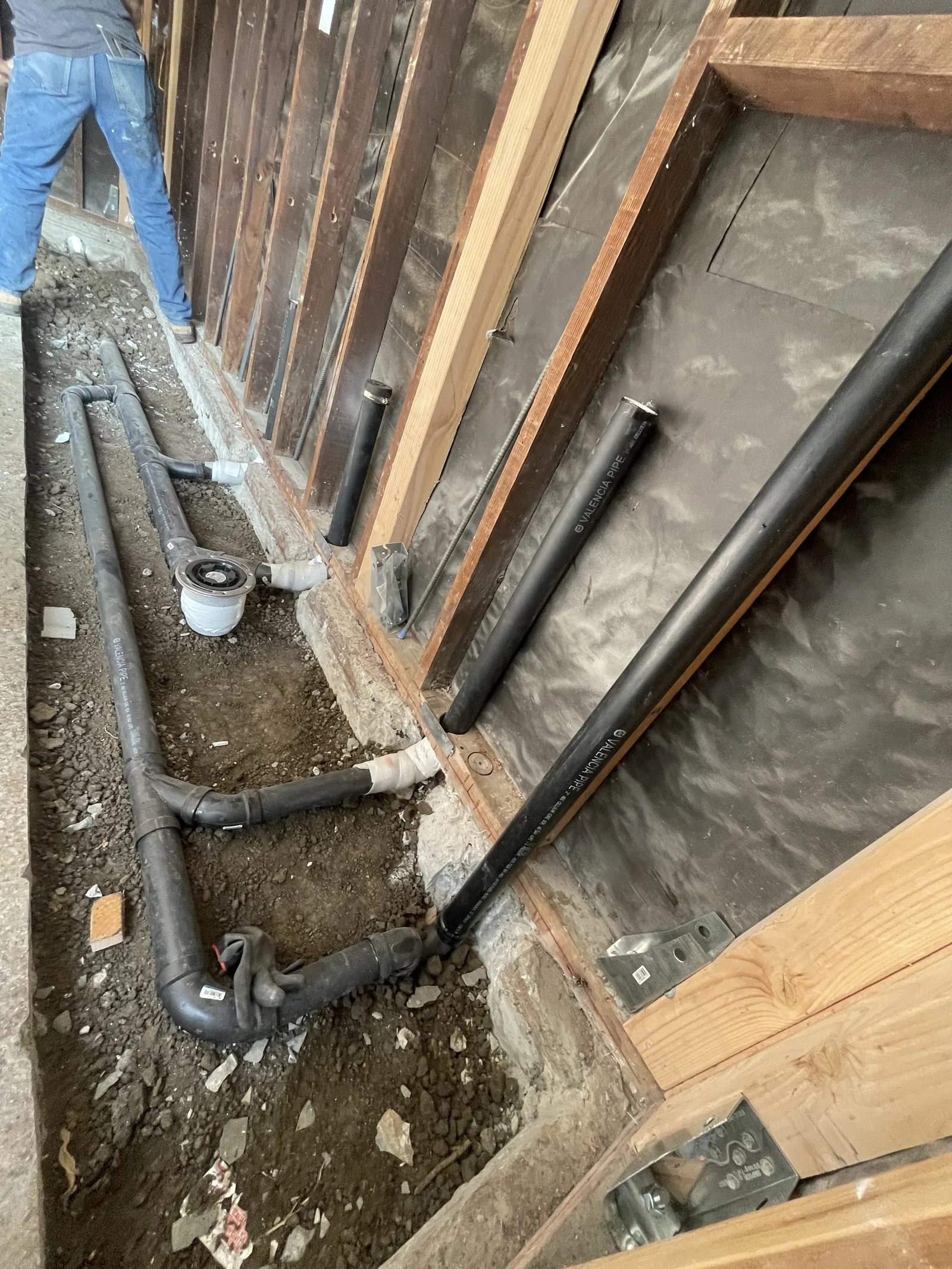 New sewer and drain lines set into the garage floor