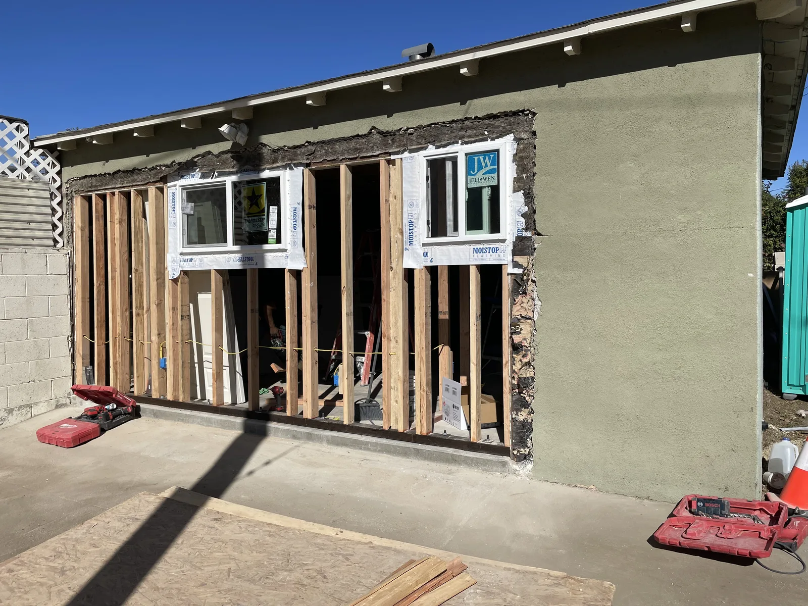 Two new window openings framed into an exterior wall