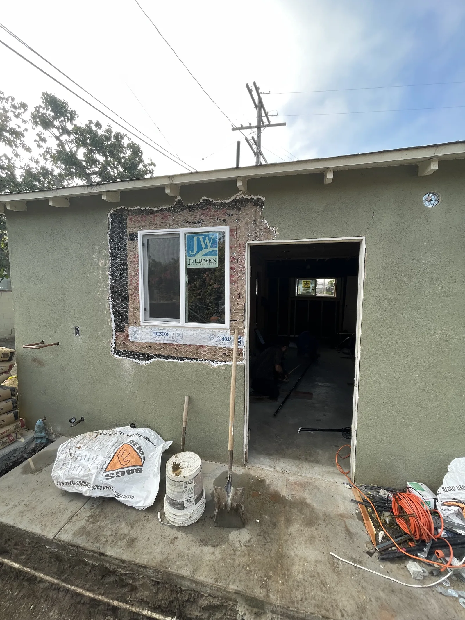 A new window and a new door opening framed into an exterior wall