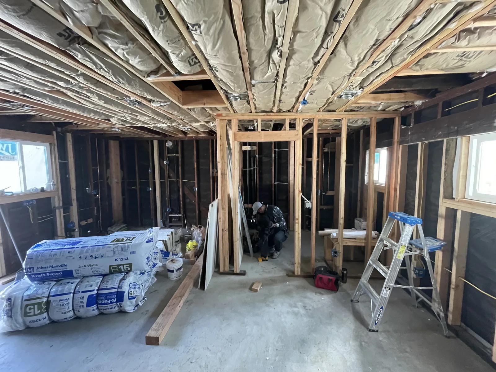 Ceiling insulation installed, with interior wall framing for new rooms