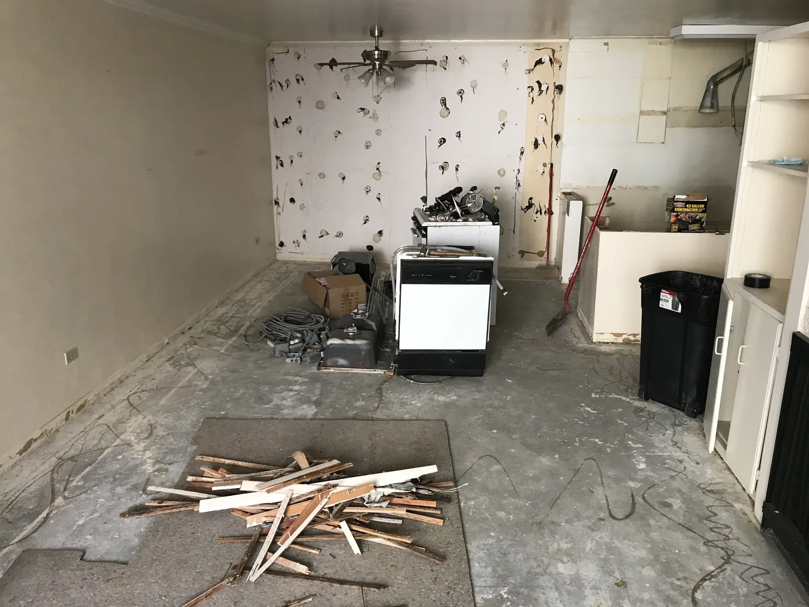 A kitchen with the cabinets removed and the walls stripped down for the rebuild