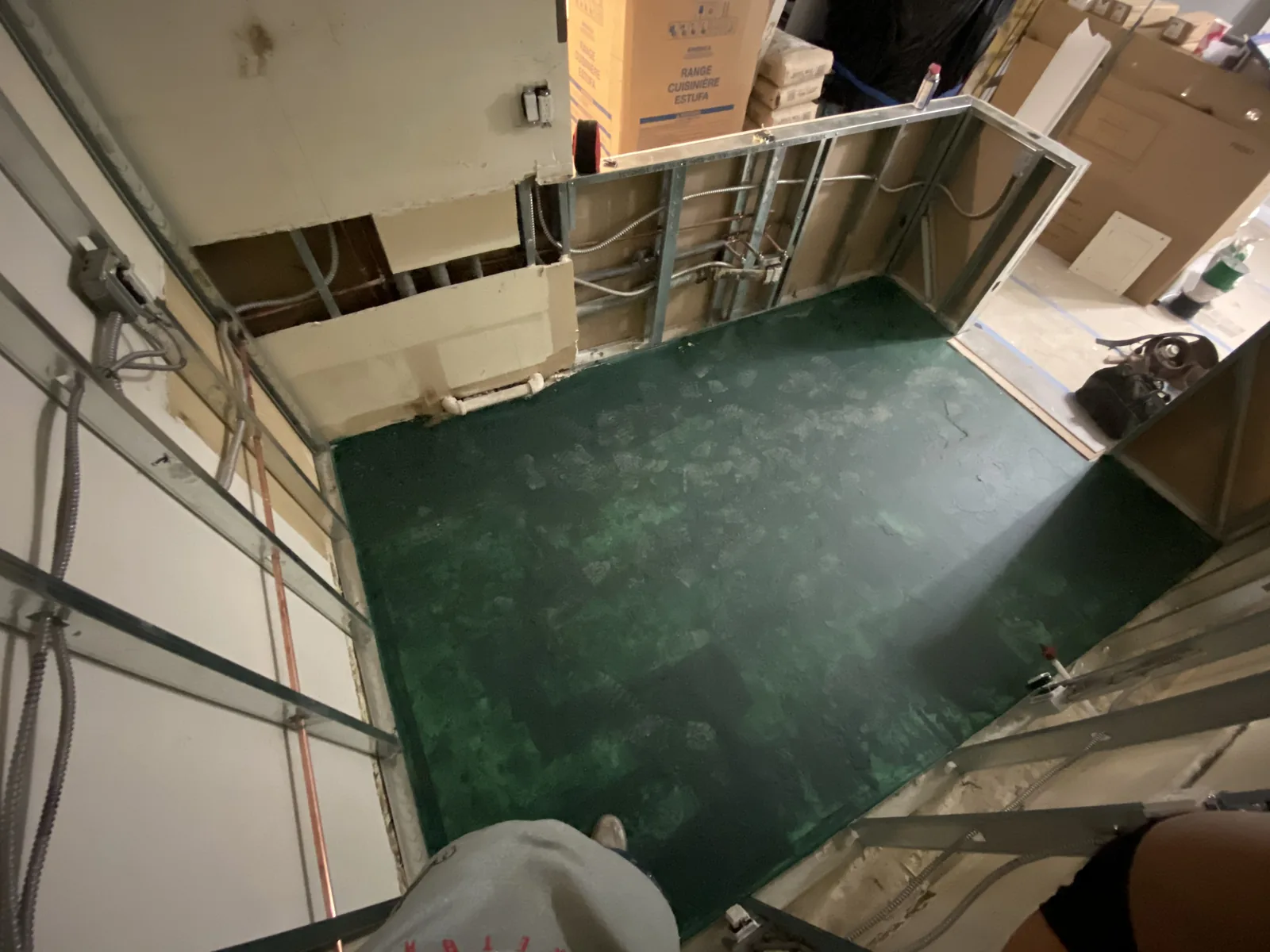 Another angle of the waterproofed shower pan and new metal-stud framing in the second bathroom