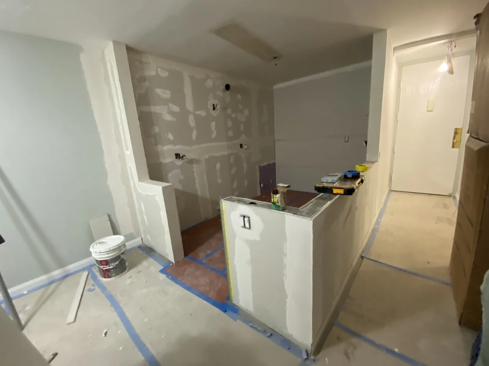 New framing and drywall for a kitchen peninsula base