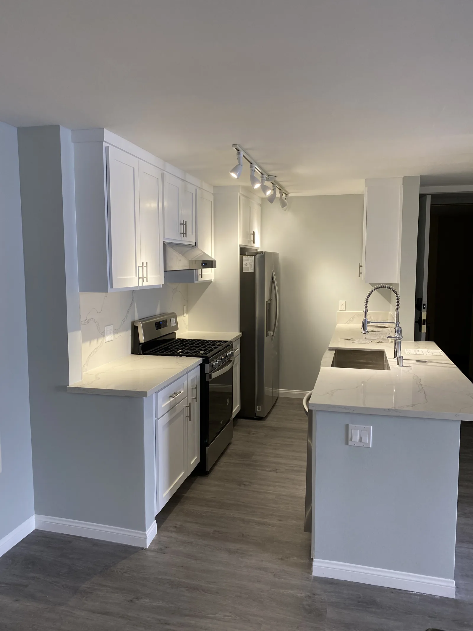 A wide view of the finished kitchen island and cabinetry