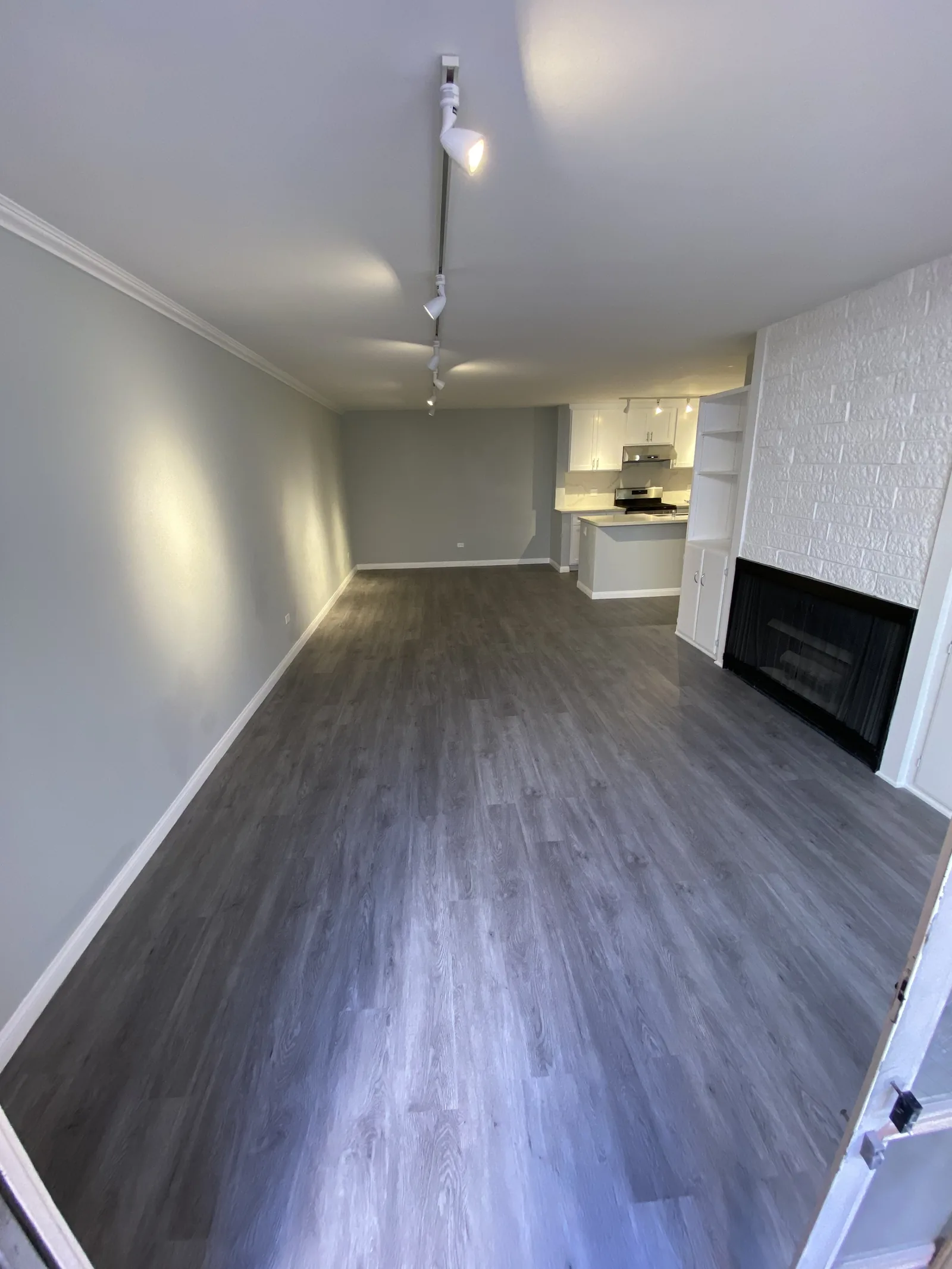 Another angle of the finished living room with the fireplace and built-ins