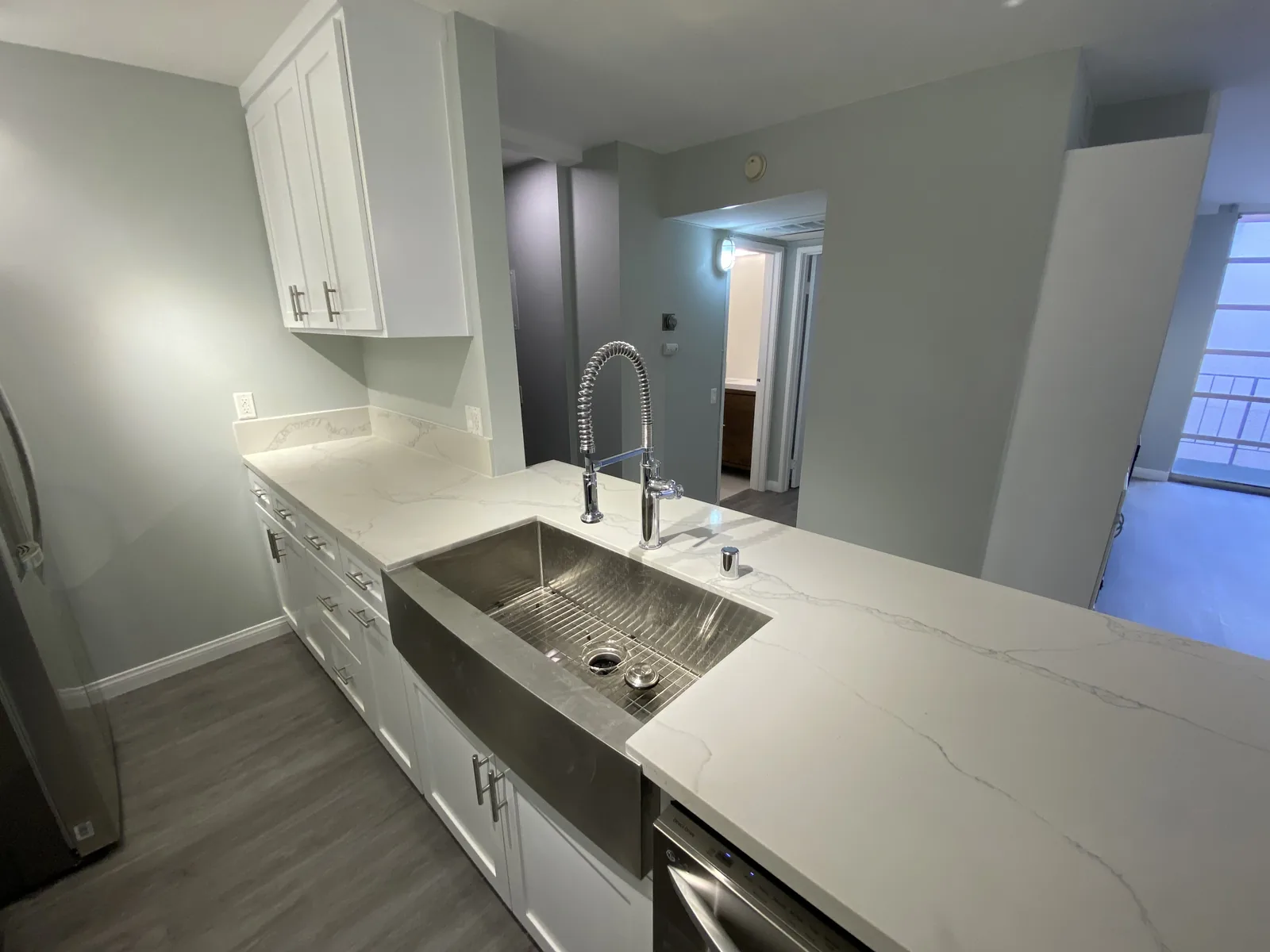 The finished kitchen sink and quartz counter
